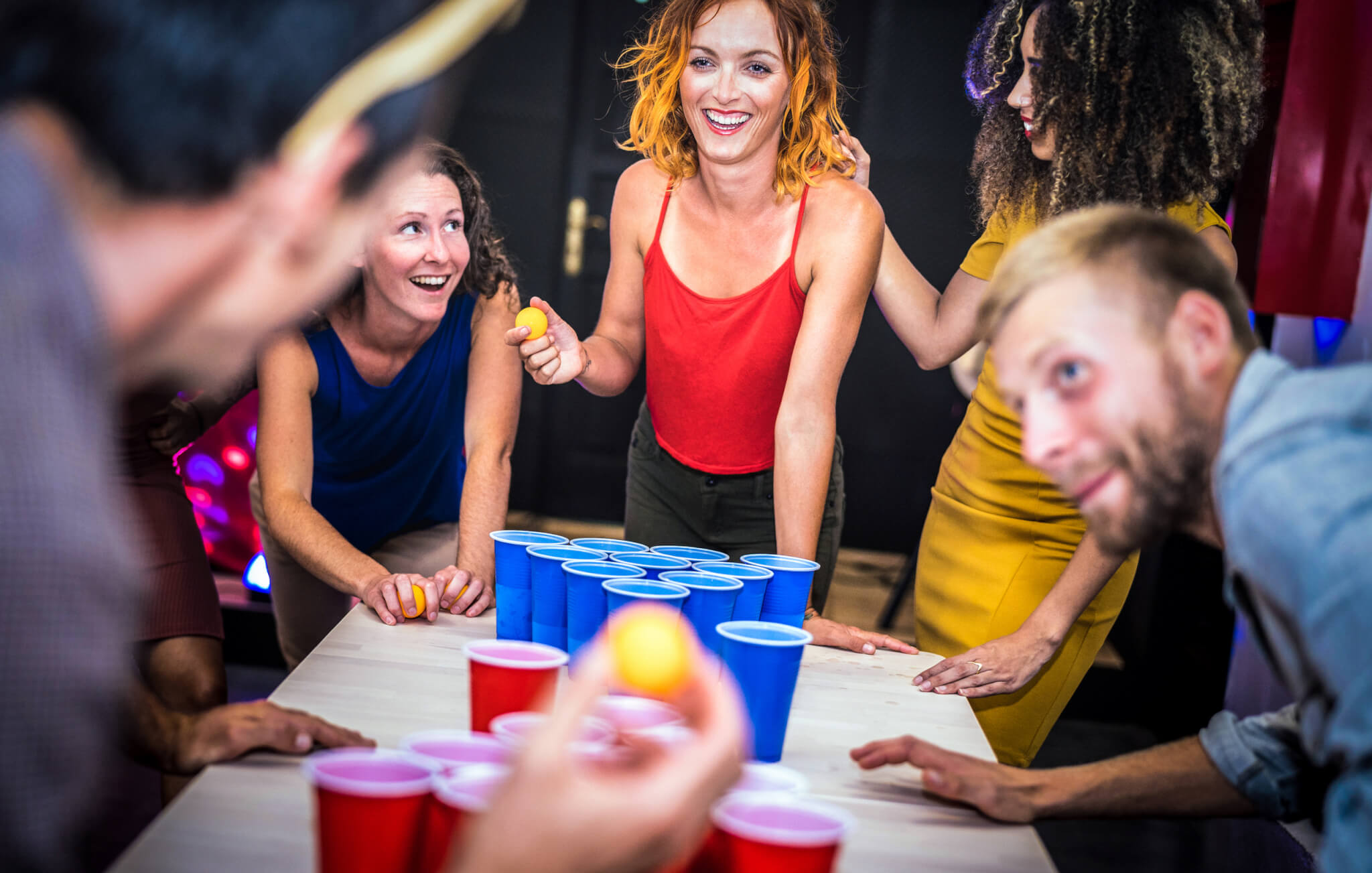 https://www.daysoftheyear.com/wp-content/uploads/young-friends-playing-beer-pong-at-youth-hostel-2022-12-09-04-46-11-utc.jpg